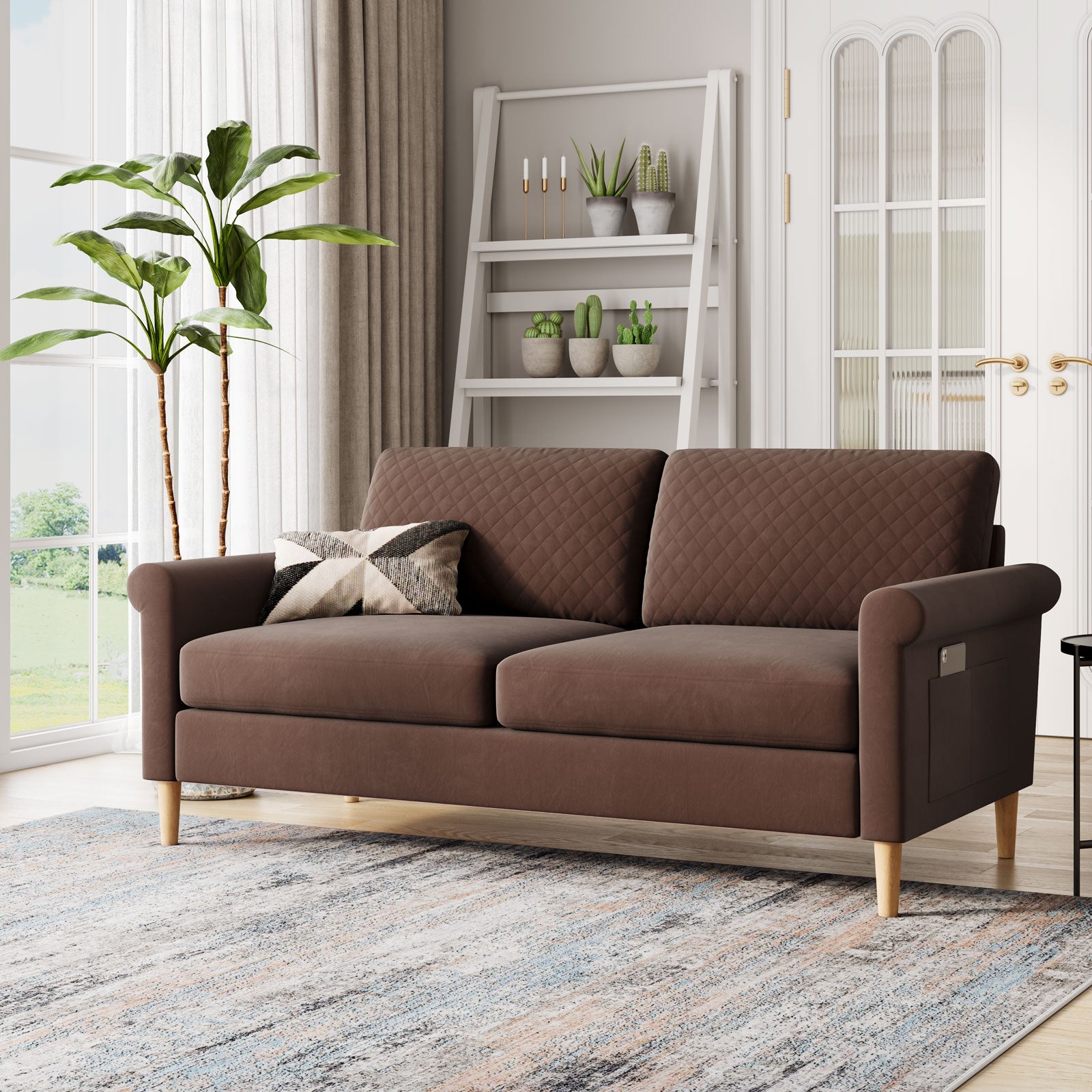 Set of two light pink fabric sofas with wooden legs, in a living room with a coffee table and wall art.