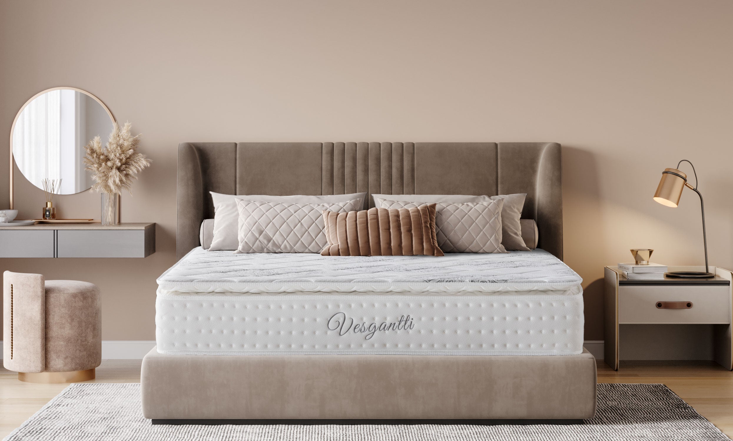A bedroom with a white mattress on a beige upholstered bed frame, decorative pillows, and a side table with a mirror and lamp.